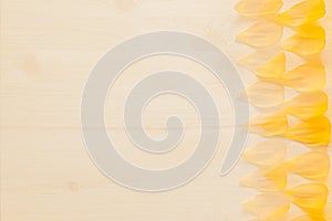 Abstract wood background with yellow flower petals. Background. Pattern.