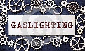 Abstract word gaslighting label torn paper recycled brown pieces on background photo