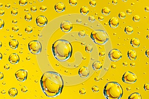 Abstract yellow background waterdrops and lemon macro picture