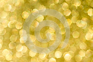 Abstract yellow bokeh background from glitter