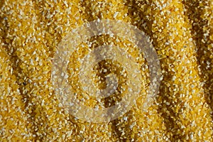 Abstract Yellow Cooking Corn Grits Background.