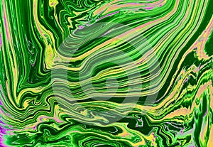 Abstract yellow-green marble background. Acrylic paint flows freely and creates an interesting pattern.