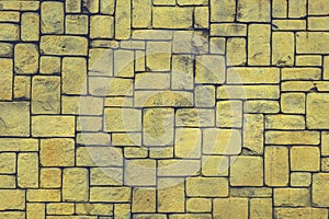 abstract yellow stone wall realistic texture ornament building rock on nature pattern bright