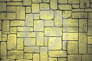 abstract yellow stone wall realistic texture ornament building rock on nature pattern bright