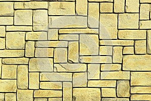 abstract yellow stone wall realistic texture ornament building rock on nature pattern bright