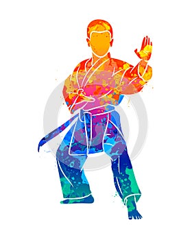 Abstract young boy in kimono training karate from splash of watercolors
