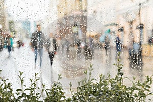 Abstract young couple walking hand in hand without an umbrella, not noticing the rain. They happy together. Concept of