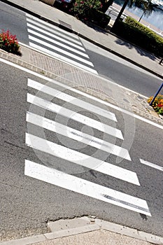 Abstract zebra crossing with water in the background