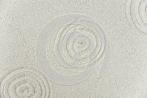 Abstract Zen drawing on white sand. Concept of harmony, balance and meditation, spa, massage, relax.