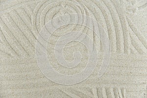 Abstract Zen drawing on white sand. Concept of harmony, balance and meditation, spa, massage, relax.