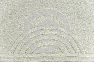 Abstract Zen drawing on white sand. Concept of harmony, balance and meditation, spa, massage, relax.