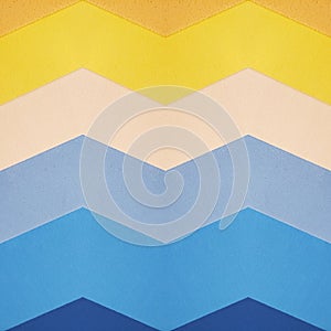abstract zigzag pattern design with cuts of foamy in yellow and blue colors, background and texture