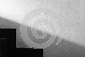 Abstracted light and shadow on the wall next to the stairs