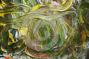 Abstraction of fluid gold green brush strokes paint. Watercolor paint abstract background.