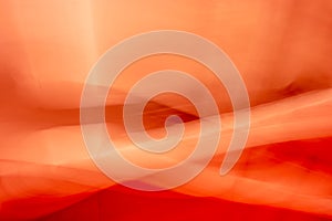 Abstraction, interweaving of waves and folds, red orange background