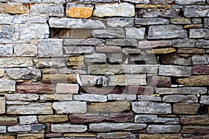 Abstraction wall fence built of natural stone background