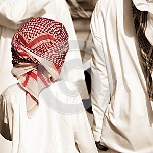 Abu Dhabi - emirate boy with red keffiyeh photo