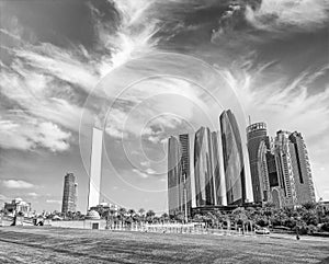 Abu Dhabi modern skyline from Emirates Palace Gardens on a sunny