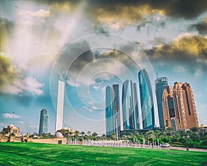 Abu Dhabi modern skyline from Emirates Palace Gardens on a sunny