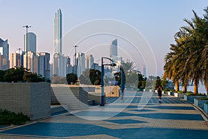 Abu Dhabi Skyline from Corniche. Abu Dhabi, Modern Skyscrapers and Landmark. Promenade in Abu Dhabi. United Arab Emirates, Middle