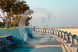 Abu Dhabi Skyline from Corniche. Abu Dhabi, Modern Skyscrapers and Landmark. Promenade in Abu Dhabi. United Arab Emirates, Middle