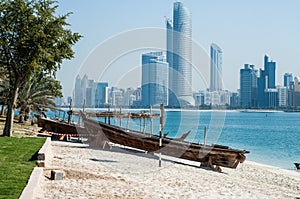 Abu Dhabi skyline plus racing Dhows in the forground