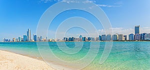 Abu Dhabi Skyline with water, skyscraper and beach, panoramic view