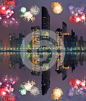 Abu Dhabi with skyscrapers against fireworks in United Arab Emirates