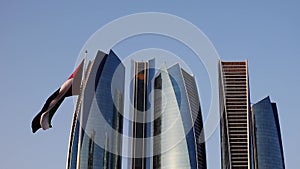 Abu Dhabi , UAE - 10 october 2020 : Capital City of United Arab Emirates with emirates flag, etihad towers, ADNOC head office,