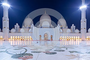Abu Dhabi, UAE - March 26, 2014: Sheikh Zayed Grand Mosque in Abu Dhabi at dusk, UAE. Grang Mosque in Abu Dhabi is the largest