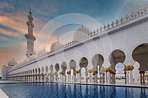 Abu Dhabi, UAE - March 26, 2014: Sheikh Zayed Grand Mosque in Abu Dhabi at sunset, UAE. Grang Mosque in Abu Dhabi is the largest
