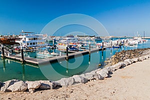 ABU DHABI, UAE - MARCH 7, 2017: Boats in Marina Breakwater, United Arab Emirat