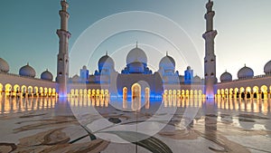 ABU DHABI, UAE - MAY 2017: Panoramic timelapse of Sunset in Sheikh Zayed Mosque in Abu Dhabi, United Arab Emirates