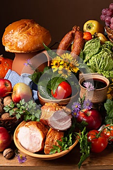 Abundance vegetables, fruits, meat products on the table