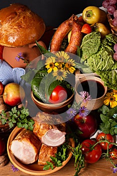 Abundance vegetables, fruits, meat products on the table