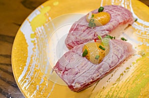 Aburi salmon sushi or Aburi sake nigiri in Japanese style fresh serve on yellow plate. healthy food. Japanese traditional food photo