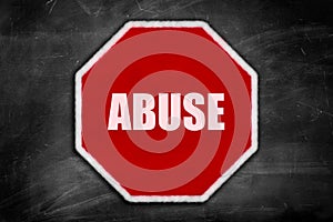 Abuse written on a stop sign