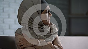 Abused arab female thinking of troubles, desperate woman worrying, anxiety