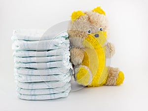 Aby diapers and soft toy on a white background diaper