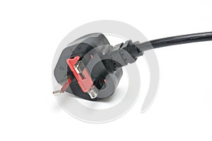 AC power plug British standard and cable on a white background