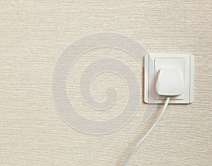 AC power plug in wall socket