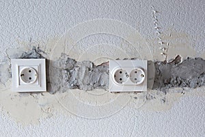 AC power socket in wall. Repairs in the apartment