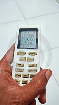 AC remote in hand
