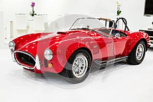 AC Shelby Cobra 427 classic roadster sports car showcased at the Techno Classica Essen Car Show. Germany - April 6, 2017