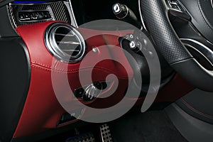 AC Ventilation Deck in Luxury modern Car Interior. Modern car interior details with red and black leather with red stitching.