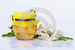 Acacia honey on white background