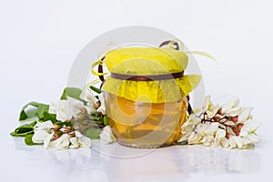 Acacia honey on white background