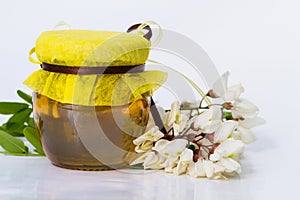 Acacia honey on white background