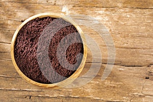 Acai berries powder - Euterpe oleracea. Wood background