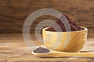 Acai berries powder - Euterpe oleracea. Wood background